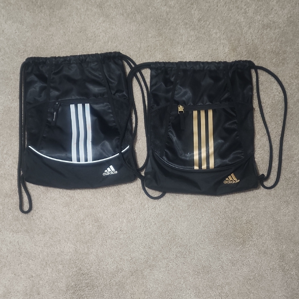 Adidas Black Backpacks with Gold and Silver Stripes